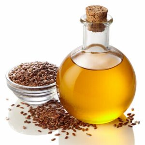 Bottle of linseed oil isolated on white background